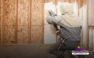 Spray foam insulation being applied in an attic